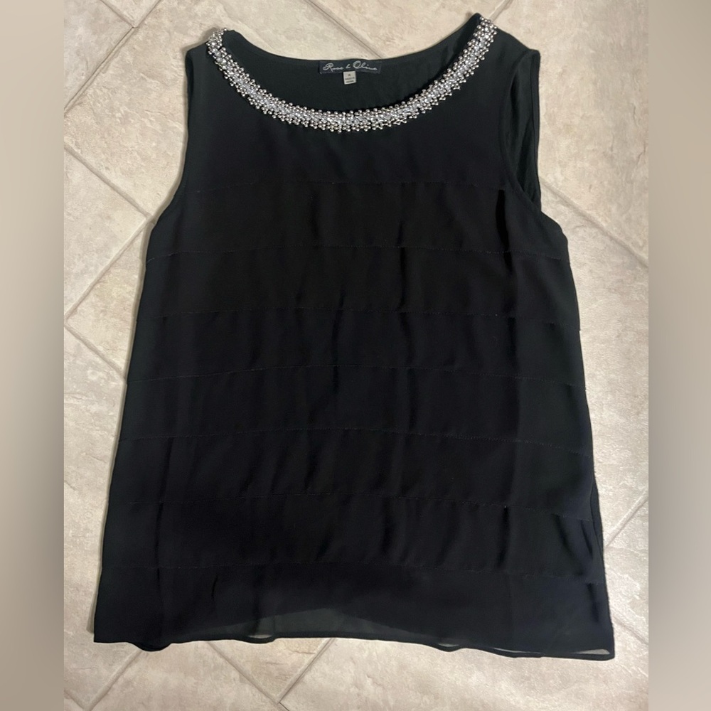 Rose & Olive black sleeveless tiered women’s shirt with jeweled neckline. Med.